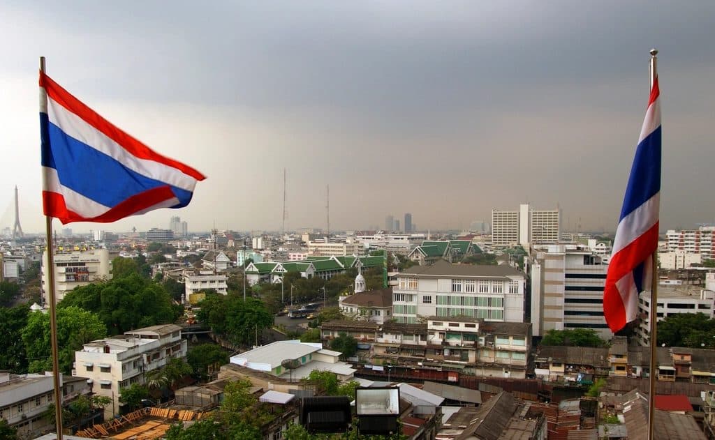 Bangkok skyline with Thai flags in the foreground